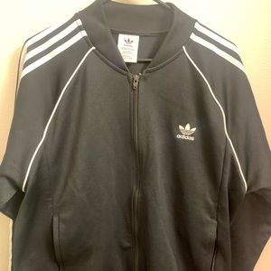 Black with white stripes Adidas track jacket.